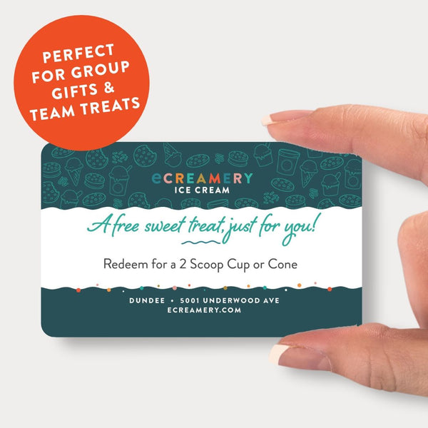 A hand holds an Ecreamery Ice Cream gift card featuring a dark teal and white design with the text 'A Free sweet treat just for you!' and 'Redeem for a 2 Scoop Cup or Cone'. An orange circular badge in the top left says 'PERFECT FOR GROUP GIFTS & TEAM TREATS'.