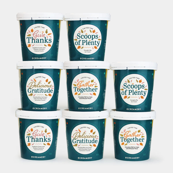 Eight tubs of ice cream labeled for Autumn. Each tub has a dark teal label with white lids and circular labels featuring autumn-themed text such as 'Give Thanks,' 'Scoops of Plenty,' 'Delicious Gratitude,' and 'Gather Together.